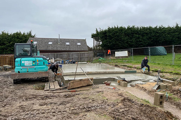 Pouring the concrete for the foundations